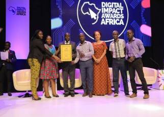 UBA Uganda staff show the accolade they won for LEO Chat banking