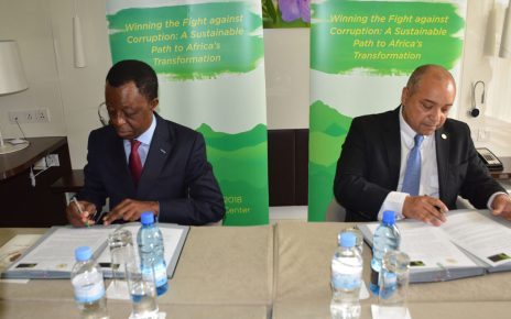 African Tax Administration Forum Executive Secretary Logan WORT and the President of the Pan-African Parliament Roger Nkodo DANG sign documents to strengthen tax laws in Africa