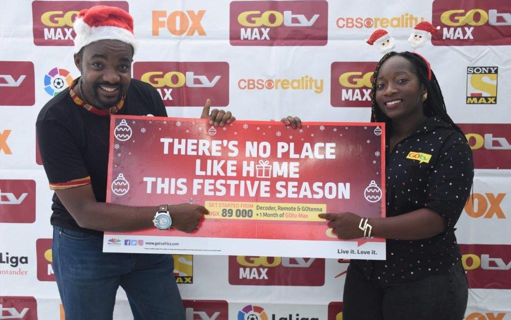 L-R: Albert Nga (L) GOtv Marketing Manager and Tina Wamala (R) PR and Communications Manager unveil the new bundled offer for GOtv subscribers this festive season 2018 ,the announcement was made today at MultiChoice Uganda offices in Kololo, Kampala