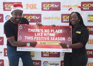 L-R: Albert Nga (L) GOtv Marketing Manager and Tina Wamala (R) PR and Communications Manager unveil the new bundled offer for GOtv subscribers this festive season 2018 ,the announcement was made today at MultiChoice Uganda offices in Kololo, Kampala