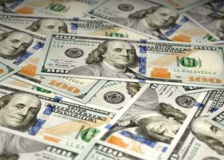The U.S. dollar eased on Tuesday, but still remained near a 16-month high in anticipation of Federal Reserve rate hikes.