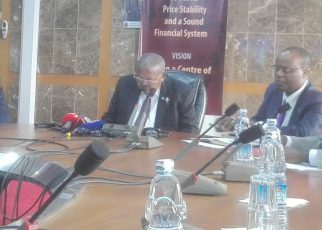 Bank of Uganda officials led by Governor Emmanuel Tumusiime Mutebile (2nd left) present the CBR in Kampala today
