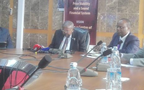 Bank of Uganda officials led by Governor Emmanuel Tumusiime Mutebile (2nd left) present the CBR in Kampala today