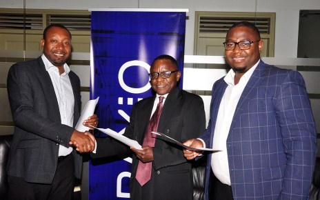 Raxio General Manager James Byaruhanga and Paul Nalikka, Director, Hamilton Telecom, flanked by Ahura Vianne Allan the CFO, signed for their respective organisations, at Raxio’s offices at Rwenzori Towers, Nakasero, Kampala