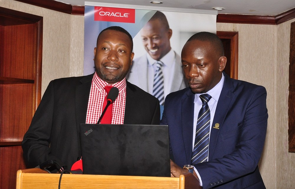 (L-R) James Byaruhanga, the Raxio Data Centre General Manager and Byron Osiro, the Oracle Senior Cloud Platform Manager, East Africa. Osiro said that there was need for regulatory support so as to encourage businesses in Uganda to quickly adopt and benefit from the immense benefits presented by cloud services.