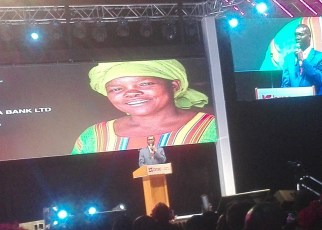 Jimmy Onesmus Adiga the BRAC Uganda Bank Ltd Chief Executive Officer speaking during the launch at Kampala Serena Hotel.