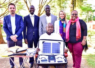 President Yoweri Kaguta Museveni carrying some a package of some of the products manufactured by Fonix industry as he posed for a photograph with a team from the Fonix industry shortly after their meeting at State House Nakasero on Saturday 30th March 2019.