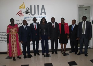 Uganda's State Minister for Investment Evelyn Anite (4L) with the New Board Members of Uganda Investment Authority.