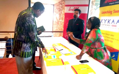 Commissioner Patrick Tusiime being briefed by one of Troikaa representative on the various products they offer on the Ugandan markets