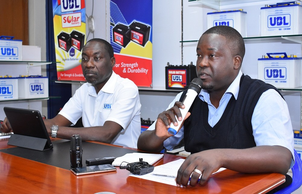 Moses Zizinga, the Uganda Batteries Limited Marketing Director (L) with Marvin Mulinde the Head of Legal Services at Uganda Batteries Limited addressing a press conference at their head offices.