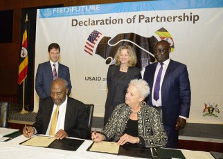 Uganda’s Prime Minister Dr Ruhakana Rugunda and US Ambassador to Uganda Deborah R. Malac signing the partnership