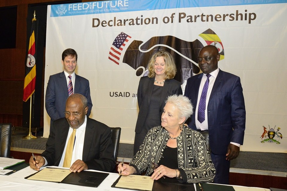 Uganda’s Prime Minister Dr Ruhakana Rugunda and US Ambassador to Uganda Deborah R. Malac signing the partnership