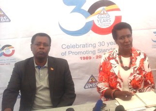 UNBS Executive Director Ben Manyindo and Minister of Trade Industries and Cooperatives Amelia Kyambadde during the event to mark 30 years of the agency