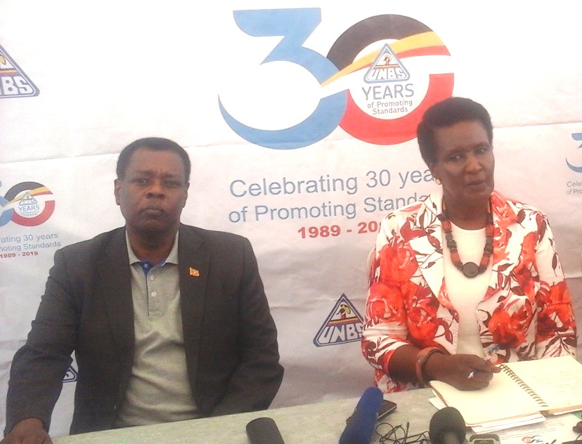 UNBS Executive Director Ben Manyindo and Minister of Trade Industries and Cooperatives Amelia Kyambadde during the event to mark 30 years of the agency