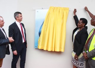 Minister of Trade Industries and Cooperatives, Amelia Kyambadde (2nd right) commissions the Rwenzori Pure Natural Water production line at Namanve Industrial park in Mukono District on Tuesday