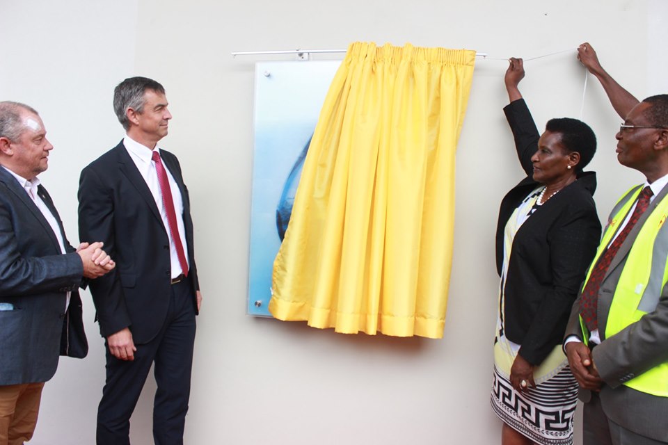 Minister of Trade Industries and Cooperatives, Amelia Kyambadde (2nd right) commissions the Rwenzori Pure Natural Water production line at Namanve Industrial park in Mukono District on Tuesday