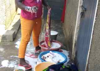 Akello is able to pay for her tuition with money earned from doing laundry