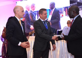 The Vice President of Uganda, Edward Kiwanuka Ssekandi (Right) hands over an award of exceptional performance and contribution towards viral Hepatitis response in Uganda and the world, to Nicolas Granier, General Manager Africa (Centre) Infectious Disease - Markets, Rapid Diagnostics, Abbott and Jerome Clavel (Left), VP Global Marketing, Infectious Disease - Emerging Markets, Rapid Diagnostics, Abbott, during the opening ceremony of the Africa Hepatitis Summit at Speke Resort Munyonyo. Abbott is a manufacturer of medical diagnostics devices and kits.