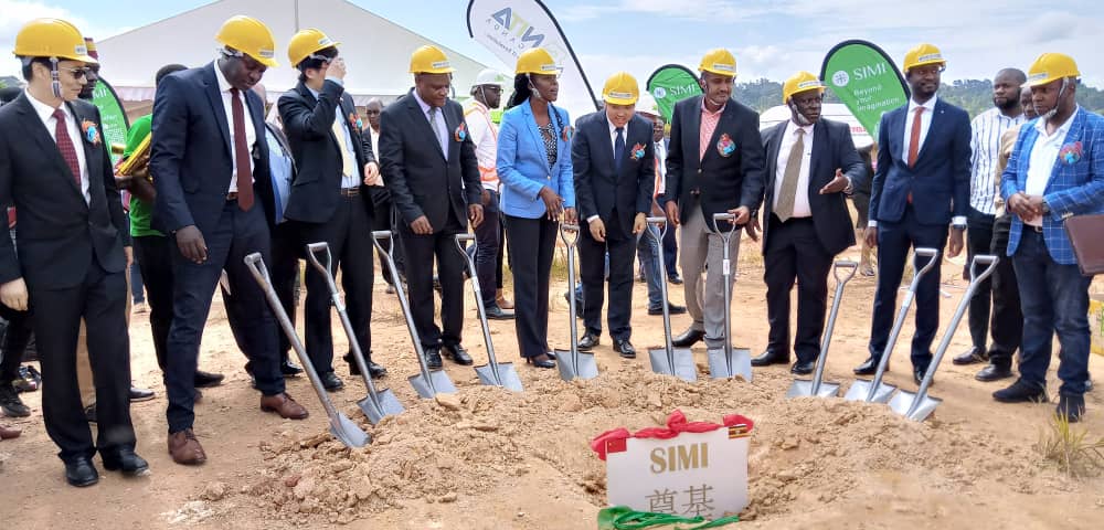 Minister Frank Tumwebaze 5th from Right with other officials at holding spades during the ground breaking for the construction of the facility