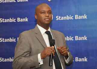 Stanbic Bank Chief Executive Patrick Mweheire, speaks during the release of the Half Year Results at Protea Hotel