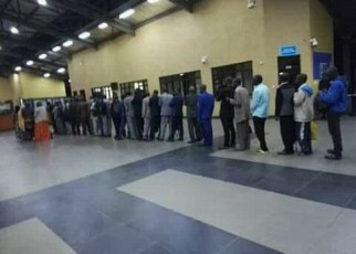 Rwandans lining up at immigration before deportation.
