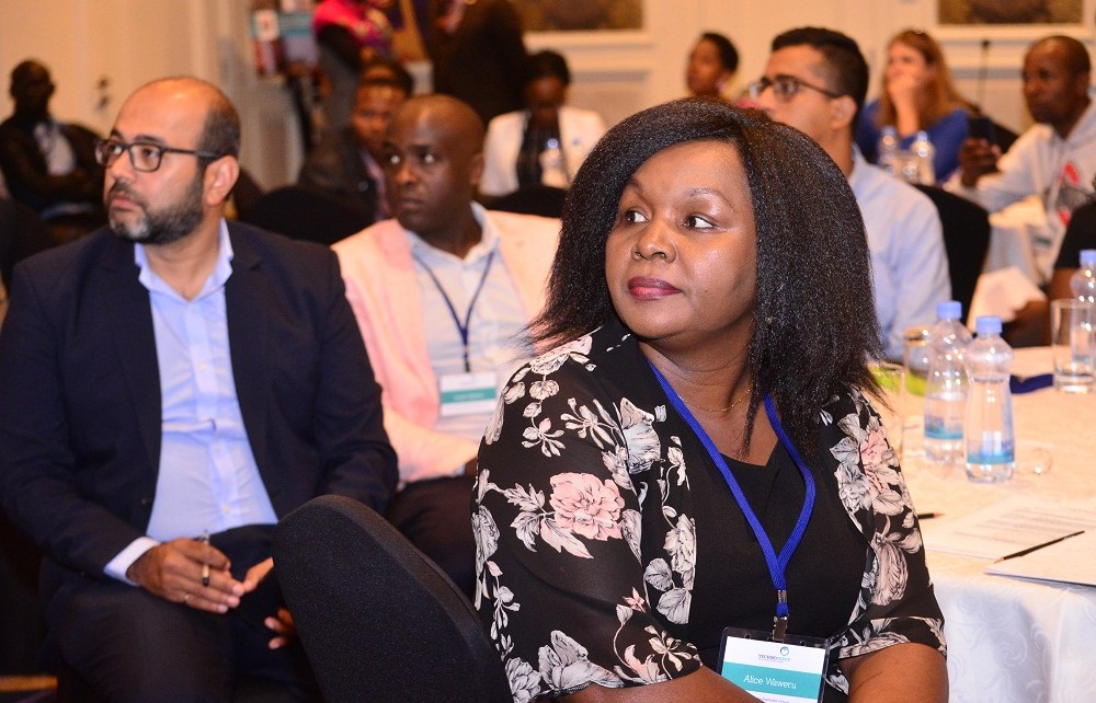 Rizwan Yusufali (L) and Alice Waweru (R) from TechnoServe follow discussions at the third Smart Duka forum. The Smart Duka program aims at boosting skills for micro-retailers.