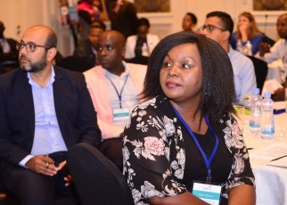 Rizwan Yusufali (L) and Alice Waweru (R) from TechnoServe follow discussions at the third Smart Duka forum. The Smart Duka program aims at boosting skills for micro-retailers.