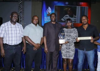 Joseph Awino - General Manager Sales Fresh Dairy(L), Vincent Omoth - Marketing Manager Fresh Dairy (2L), Hon. Micheal Werikhe – Minister of State for Trade (C), Rita Bwiza – Customer Care Executive Fresh Dairy (2R) and Edgar Wabulo – Sales Operations (R ) pose with the People’s Choice Award 2019 – Yoghurt Category that Fresh Dairy won. Fresh Dairy Flavoured yoghurt is popular for its thickness, creaminess, aroma, flavours and natural taste.