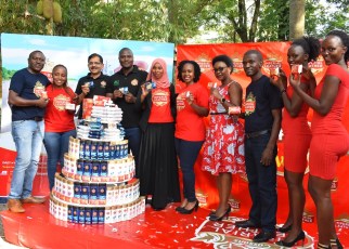 Innocent Tibayeita (4th R), African Queen Managing Director, Sekar Ramamoorythy (3rd R), Managing Director PZ Cussons East Africa, and staff of African Queen the distributor of Imperial Leather. This was during the media launch of the "Be Fresh and Win" consumer reward promo held at The Lawns Restaurant in Kololo, 14th October 2019.