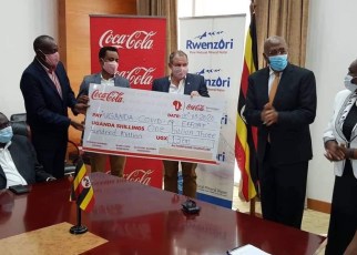 Coca-Cola Beverages Africa in Uganda has handed over its contribution of UGX1.3billion (One Billion, Three Hundred Million Shillings) with three brand new pick-up trucks added to the Ministry of Health COVID-19 fleet.