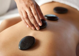 A hot stone massage is a type of massage therapy. It’s used to help you relax and ease tense muscles and damaged soft tissues throughout your body.