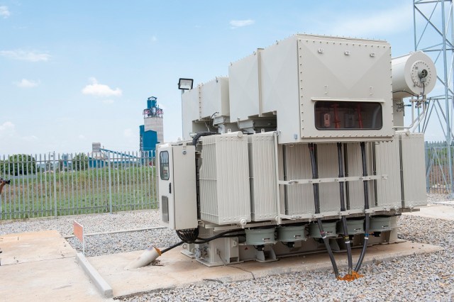 Sh14b Nyakesi transformers (left), supplying reliable electricity to Hima and Simba cement plants (right) in Tororo.jpg