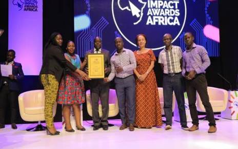 UBA Uganda staff show the accolade they won for LEO Chat banking