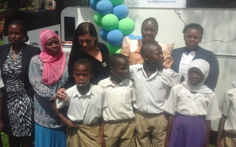 Speaker Kadaga poses in a group photo with pupils and top executives of Finance trust Bank and Craft Silicon Foundation