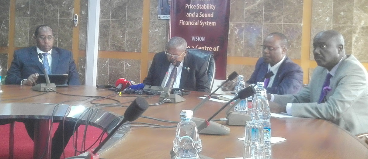 Bank of Uganda officials led by Governor Emmanuel Tumusiime Mutebile (2nd left) present the CBR in Kampala today