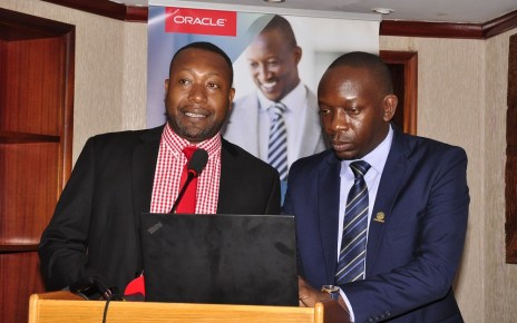 (L-R) James Byaruhanga, the Raxio Data Centre General Manager and Byron Osiro, the Oracle Senior Cloud Platform Manager, East Africa. Osiro said that there was need for regulatory support so as to encourage businesses in Uganda to quickly adopt and benefit from the immense benefits presented by cloud services.