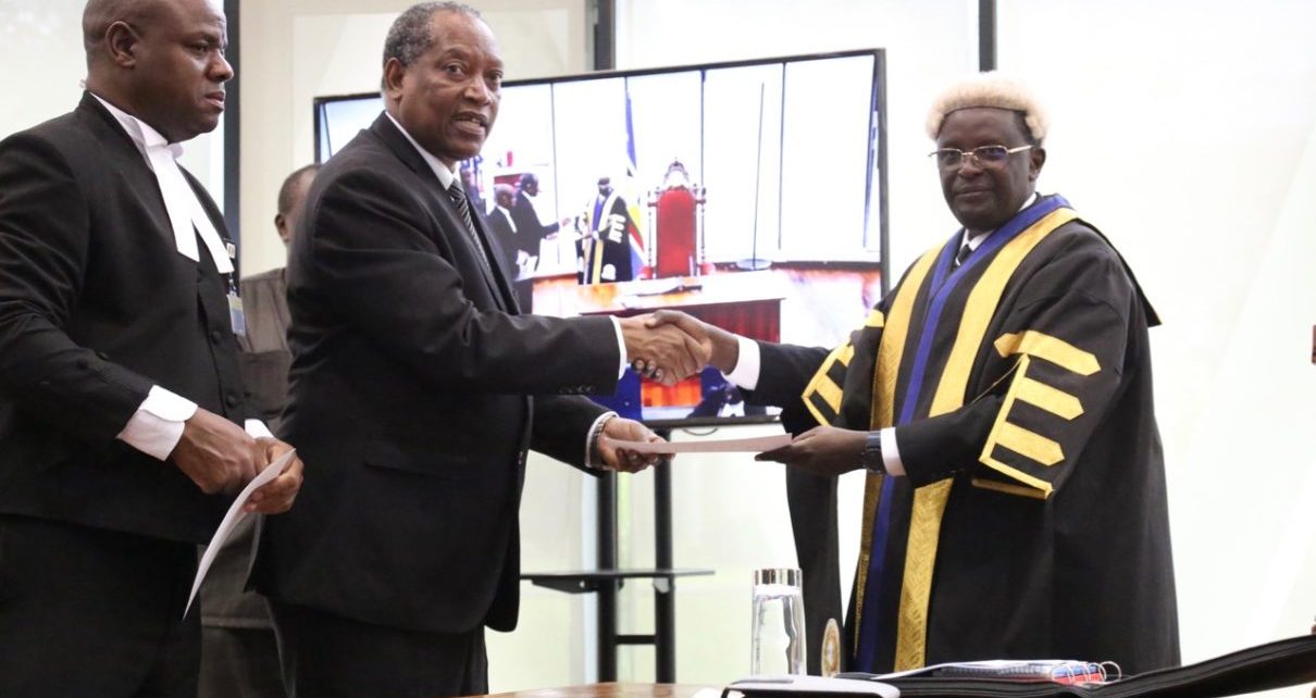 The Minister for Foreign Affairs and East African Co-operation, United Republic of Tanzania, Prof Palamagamba Kabudi takes the oath of Allegiance administered by EALA Clerk Assistant, Victor Manzi