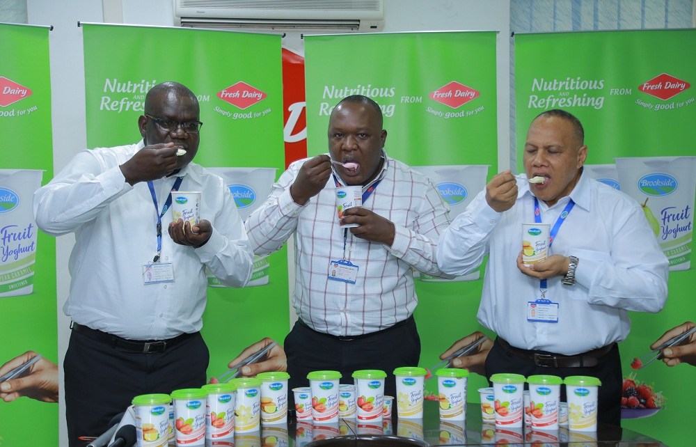 Left: Fresh Dairy officials: Joseph Awino – GM Sales (L), Vincent Omoth – Marketing Manager (C ) and Jonathan Williams (R ) - Operations Manager Production taste and launch the new Brookside Fruit Yoghurt with real fruits coming in 4 flavours: Pear Caramel, Lemon biscuits, Strawberry and Vanilla available countrywide in shops, kiosks, duukas and supermarkets.