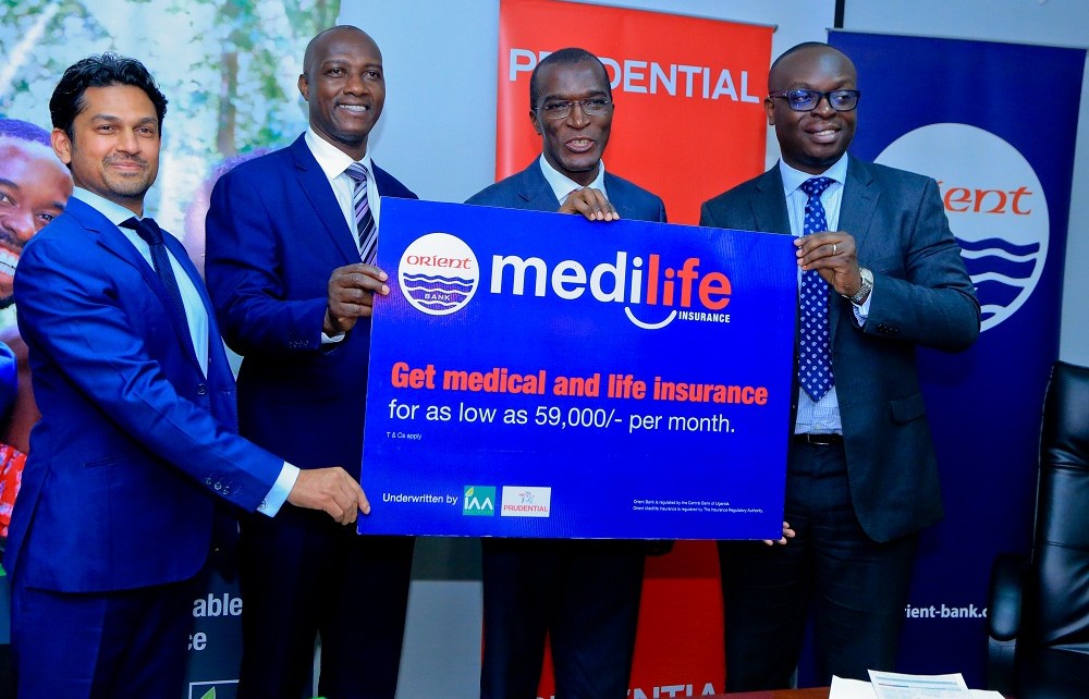 (R-L): Julius Kakeeto, MD of Orient Bank Limited together with Alhaj Kaddunabbi Ibrahim Lubega, CEO Insurance Regulatory Authority, Herbert Mukoza, General Manager IAA and Arjun Mallik, MD Prudential East Africa officially unveil medilife, a new medical and life insurance cover.