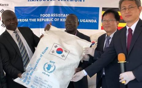 Ambassador of South Korea on Right Ha Byung-Kyoo, handing over some of the Rice sacks to the officials from the WFP
