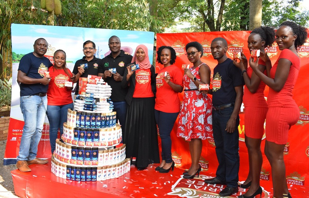 Innocent Tibayeita (4th R), African Queen Managing Director, Sekar Ramamoorythy (3rd R), Managing Director PZ Cussons East Africa, and staff of African Queen the distributor of Imperial Leather. This was during the media launch of the "Be Fresh and Win" consumer reward promo held at The Lawns Restaurant in Kololo, 14th October 2019.