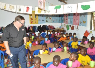 Plascon’ s Retail Marketing Manager Mr. Tyron Immelman interacts with pupils of Mother Ludia Nursery school in their newly painted classroom