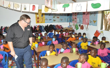 Plascon’ s Retail Marketing Manager Mr. Tyron Immelman interacts with pupils of Mother Ludia Nursery school in their newly painted classroom