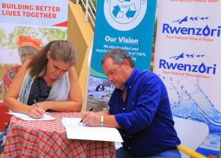 Head of Mission at the Embassy of Denmark Ms. Majbrit Holm Jakobsen and Mr. Conrad van Niekerk, the Managing Director of Century Bottling Company sign the MoU